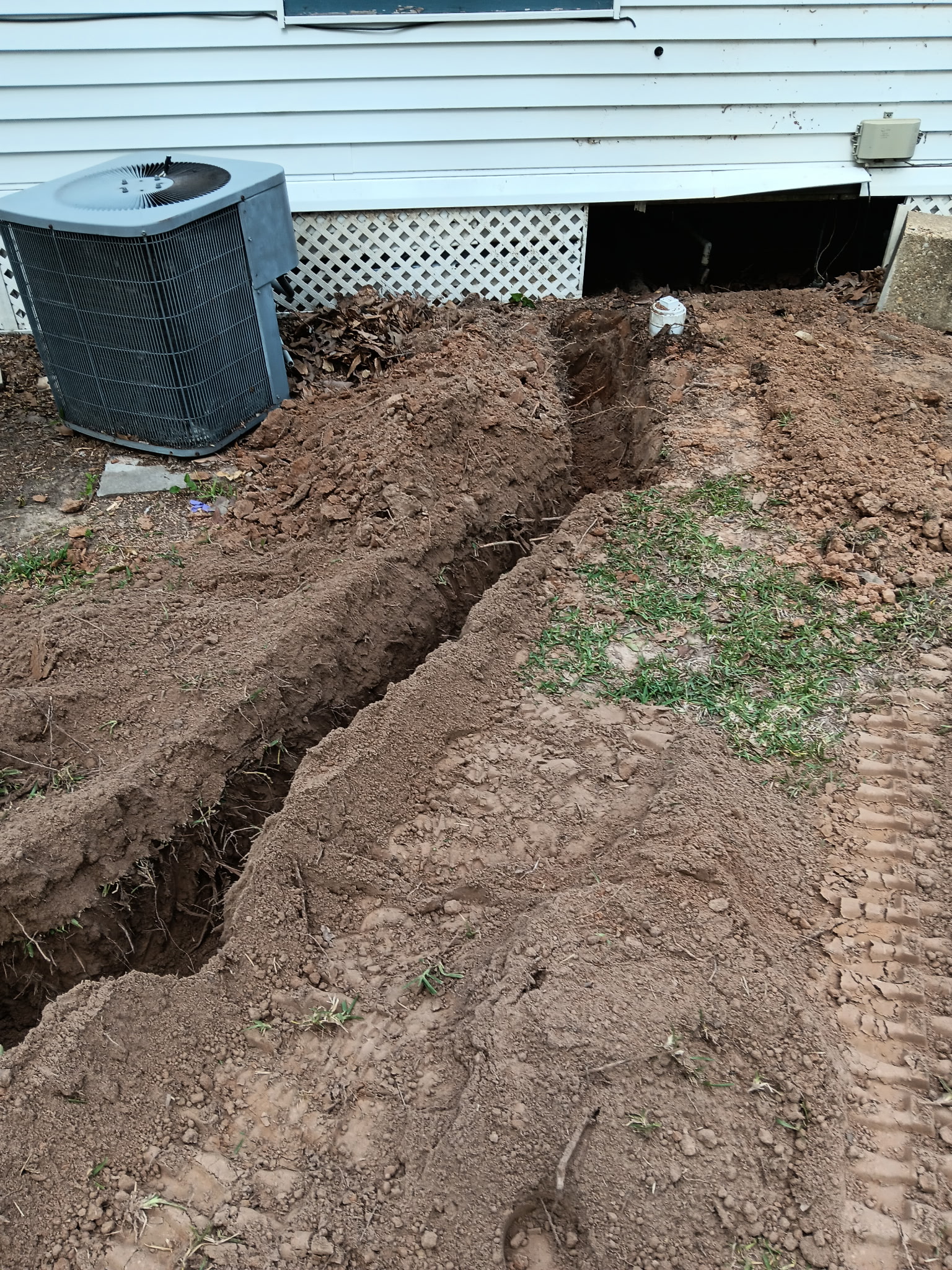 Deep trench cut beside mobile home foundation, McKinney, TX
