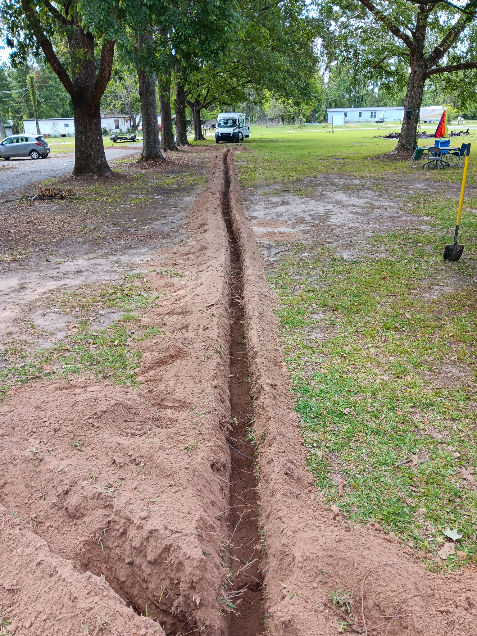 Long trench run across yard with PRD van, McKinney, TX