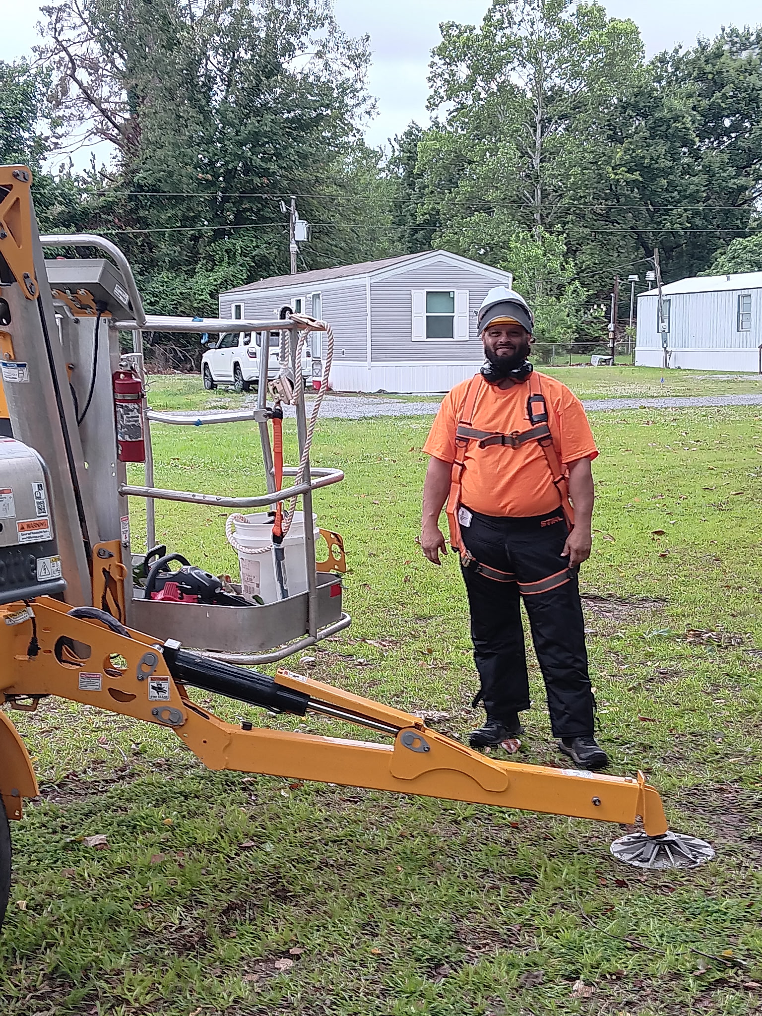 Large limb removal with orange boom lift — McKinney, TX