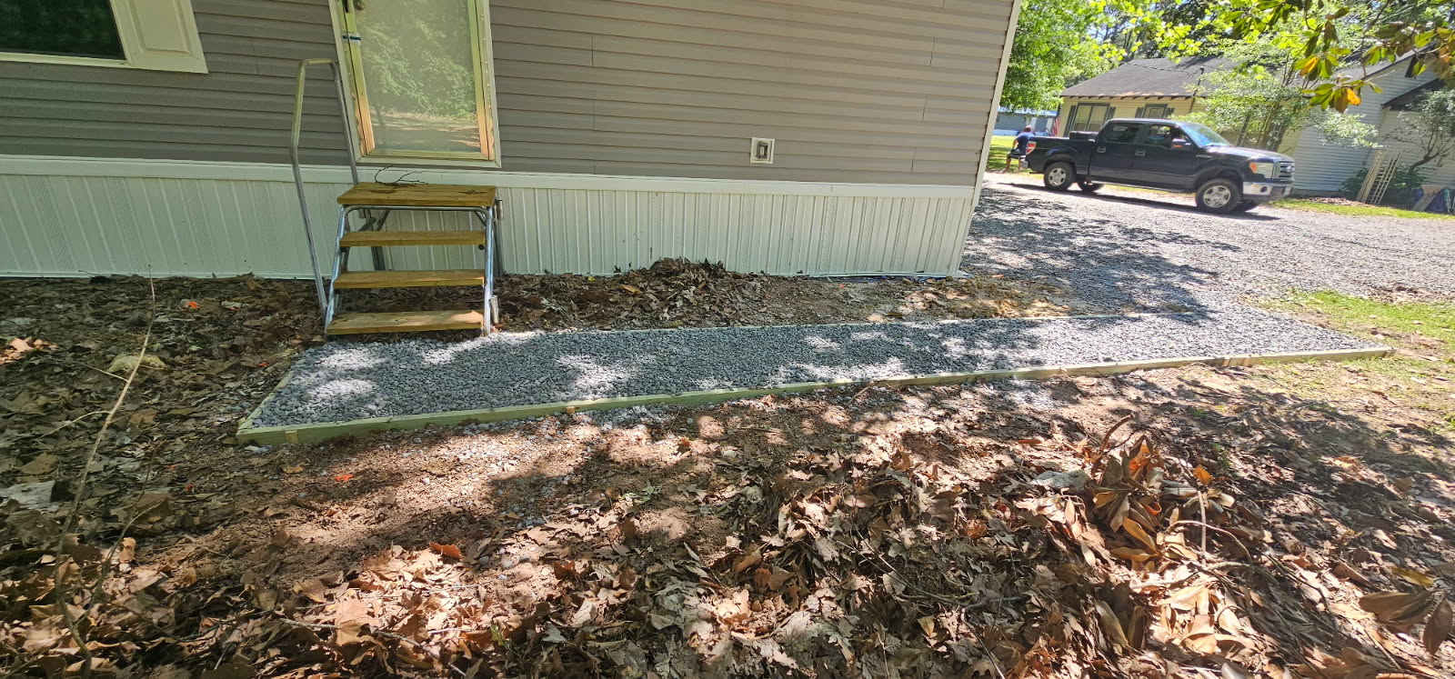Framed gravel walkway along mobile home entry, Anna, TX