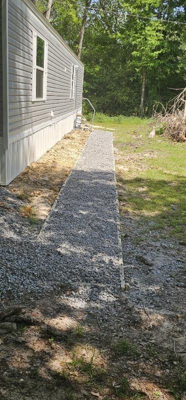 Gravel path running the length of mobile home, Anna, TX