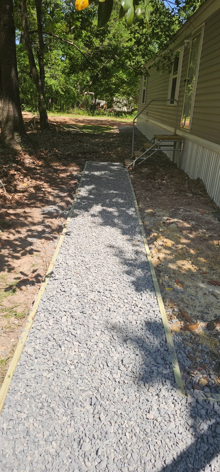 Wide gravel walkway with wood border framing, Anna, TX